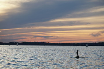 Paddle boarding at sunset