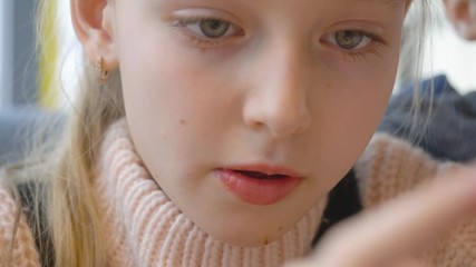 Cute little girl eating pizza. Close up front view beautiful little girl eating a slice of pizza.