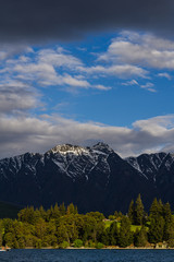 Fototapeta premium peaceful landscape during sunset with dramatic sky above mountain range, perfect hiking area