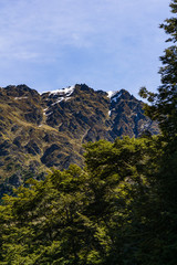 peaceful landscape during sunset with calm sky above mountain range