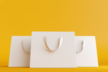 Shopping bags on yellow background. 3d rendering