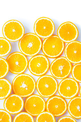 Fresh orange slices over white background, top view