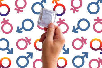 foil pack of condom in man hand on icons symbol colorful background. The concept of safety from...
