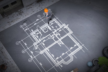 Man engineer thinking over his plan. Mixed media