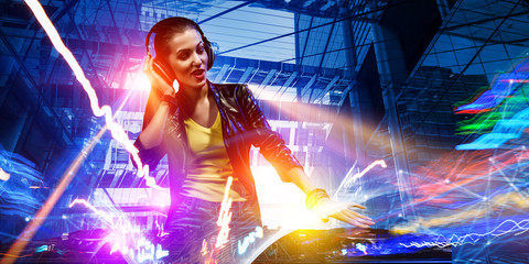 Female dj in nightclub. Mixed media