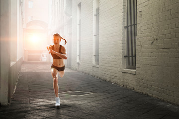 Sportswoman running race. Mixed media