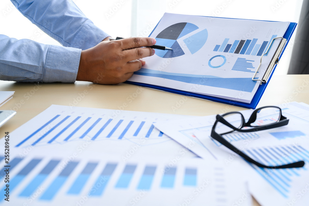 Poster business documents on office graph financial with social network diagram discussing data analysis da