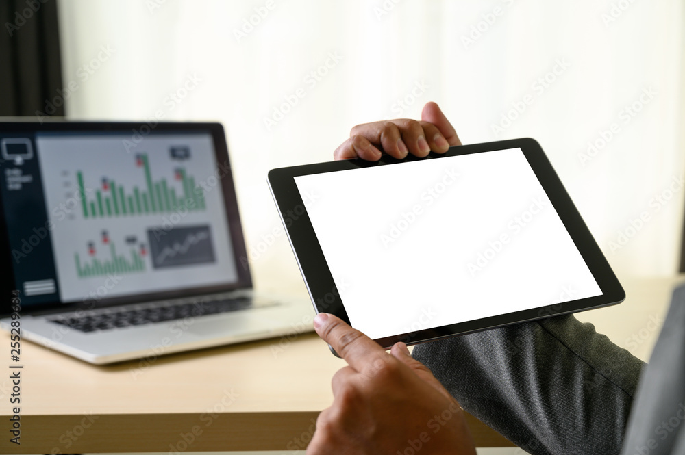Poster man hands multitasking man using tablet close up close up working in office