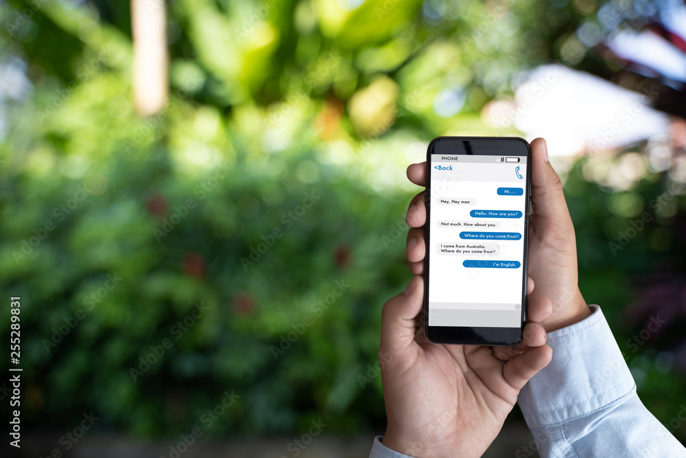 Poster man touch on button instant messaging app on mobile phone