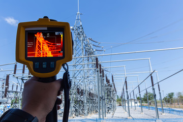 Thermoscan(thermal image camera), Industrial equipment used for checking the internal temperature of the machine for preventive maintenance, This is checking substation heat - obrazy, fototapety, plakaty