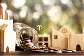 Little wood house model with coins saving for residential .