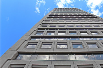 building with blue sky and clouds