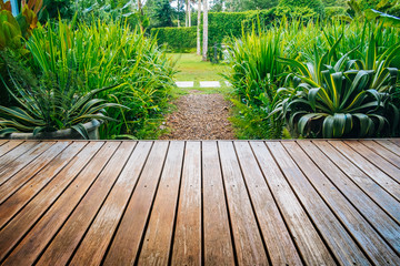 Wooden deck and tropical garden backyard.