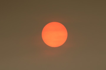 The Sun colour in the Uk was due to a weather phenomenon, Saharan dust, blown in by ex-hurricane Ophelia and also from debris, caused by fires in Portugal and Spain.