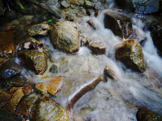 Naklejka na ściany i meble Flowing water below the Otaki-Mentaki waterfall on the Nakasendo Road, Japan