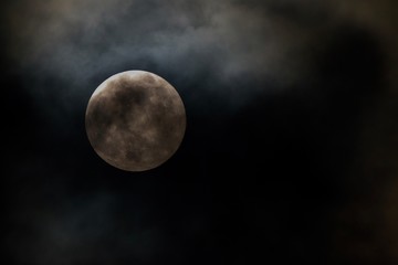 moon behind light fog
