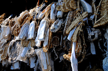 Straw sandals (waraji) and ballet slippers hanging in front of the Zenko-ji temple in Nagano, Japan