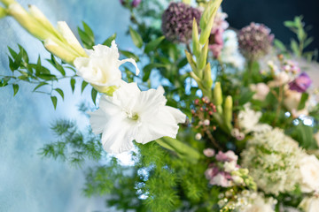 Floral decoration for wedding ceremony romance dining. Wedding banquet , festive decor. Bouquet from spring and summer flowers. Table layout. Restaurant interior. Concept of service and catering.