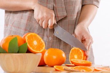 girl is learning to make fruit juicc