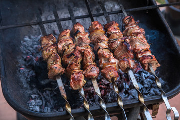 cooking grilled shish kebab on metal skewer fresh meat. cooked at barbecue bbq roasted beef meat