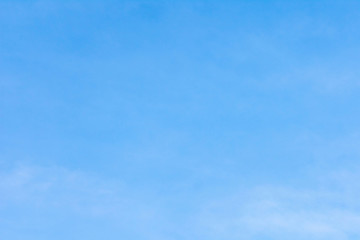 Beautiful, abstract, blue sky background. There are feathery clouds in the sky. A good place to place the text.