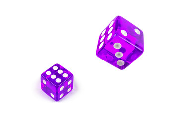 Two Proton Purple glass dices isolated on white. Six and flying in the air, view from above.