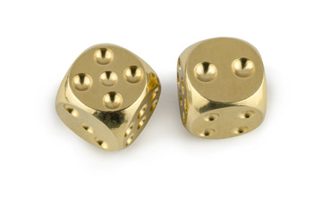 Two golden dices closeup isolated on white background. Five and two, with a shadow.