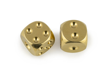 Two golden dices closeup isolated on white background. Four and two, with a shadow.