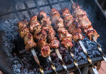 cooking grilled shish kebab on metal skewer fresh meat. cooked at barbecue bbq roasted beef meat