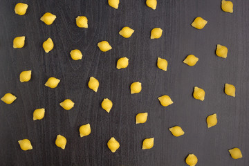 Pattern of A pile of conchiglie paste shells on black background