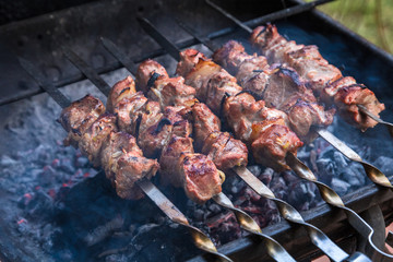 cooking grilled shish kebab on metal skewer fresh meat. cooked at barbecue bbq roasted beef meat