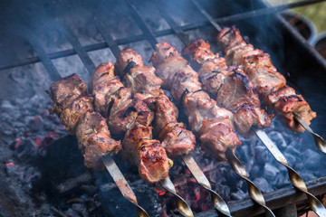 cooking grilled shish kebab on metal skewer fresh meat. cooked at barbecue bbq roasted beef meat