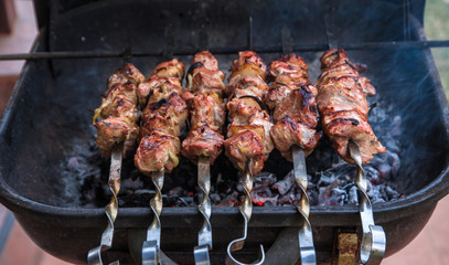 cooking grilled shish kebab on metal skewer fresh meat. cooked at barbecue bbq roasted beef meat