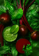 Detox vegan smoothies from raw beets and spinach, dark table, food drink background, top vieww