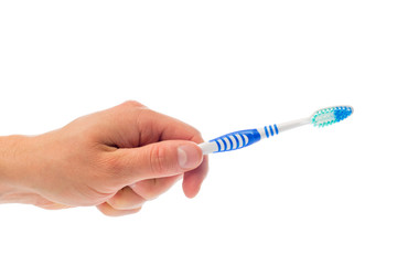 Obraz premium toothbrush in hand on an isolated background