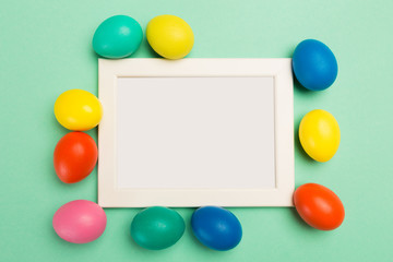 easter eggs with frame and text place on green background