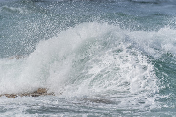 Waves Crashing on Rocks on the Southern Italian Mediterranean Coast