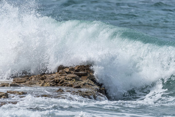 Waves Crashing on Rocks on the Southern Italian Mediterranean Coast