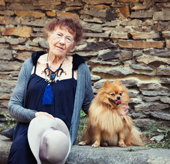 Stylish 90 years old woman walking around city