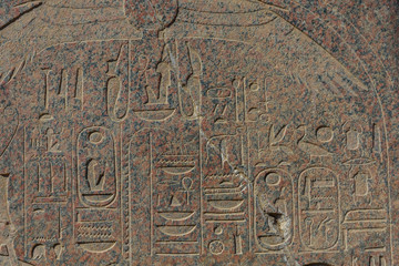 Egyptian ancient hieroglyphs on the stone wall