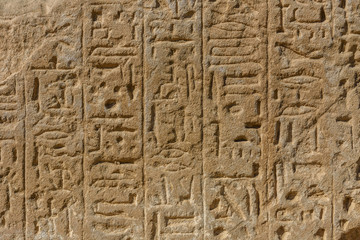 Egyptian ancient hieroglyphs on the stone wall