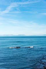 Obraz premium Blue Southern Italian Mediterranean Sea with Island in the Distance