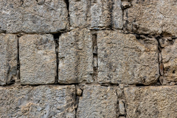 Antique stonewall masonry textured background