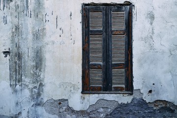 Obraz na płótnie Canvas Window against the white wall of a traditional Greek house. Rhodes Island. City of Lindos. Greece