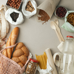 Zero waste concept, sustanable lifestyle - textile, glass and paper reusable packaging for grocery shopping, top view, flat lay, copy space, eco friendly ban plastic background