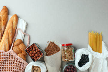 Zero waste concept, sustanable lifestyle - textile, glass and paper reusable packaging for grocery shopping, top view, flat lay, copy space, eco friendly ban plastic background