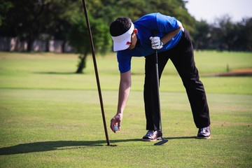 Obraz premium Man play outdoor golf sport activity - people in golf sport concept