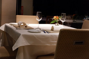 A table for a couple with glasses and cutleries