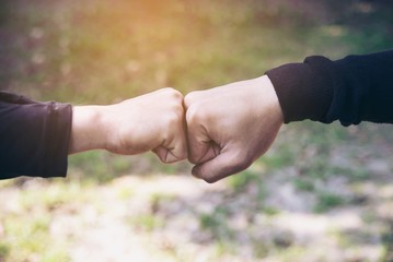 Man touching / holding hand together for success commitment work concept