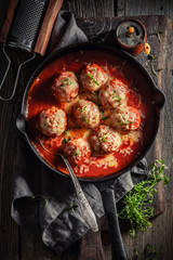 Hot meatballs with tomato sauce and cheese